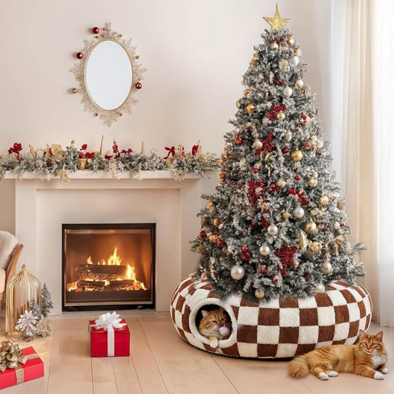 Decorated Christmas tree with a cat inside a checkered pet bed, fireplace, and presents in a cozy living room.