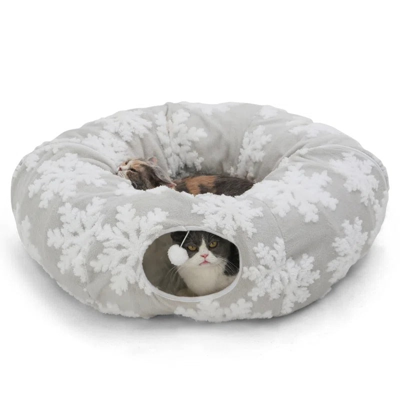 he Christmas cat tunnel can be placed around your Christmas tree to protect it or unfolded into a long tunnel for your cats to burrow and play. You can also enclose the tunnel into a circle and pair with soft mat to create a cozy cat bed, providing your cat with a warm and comfortable resting space.