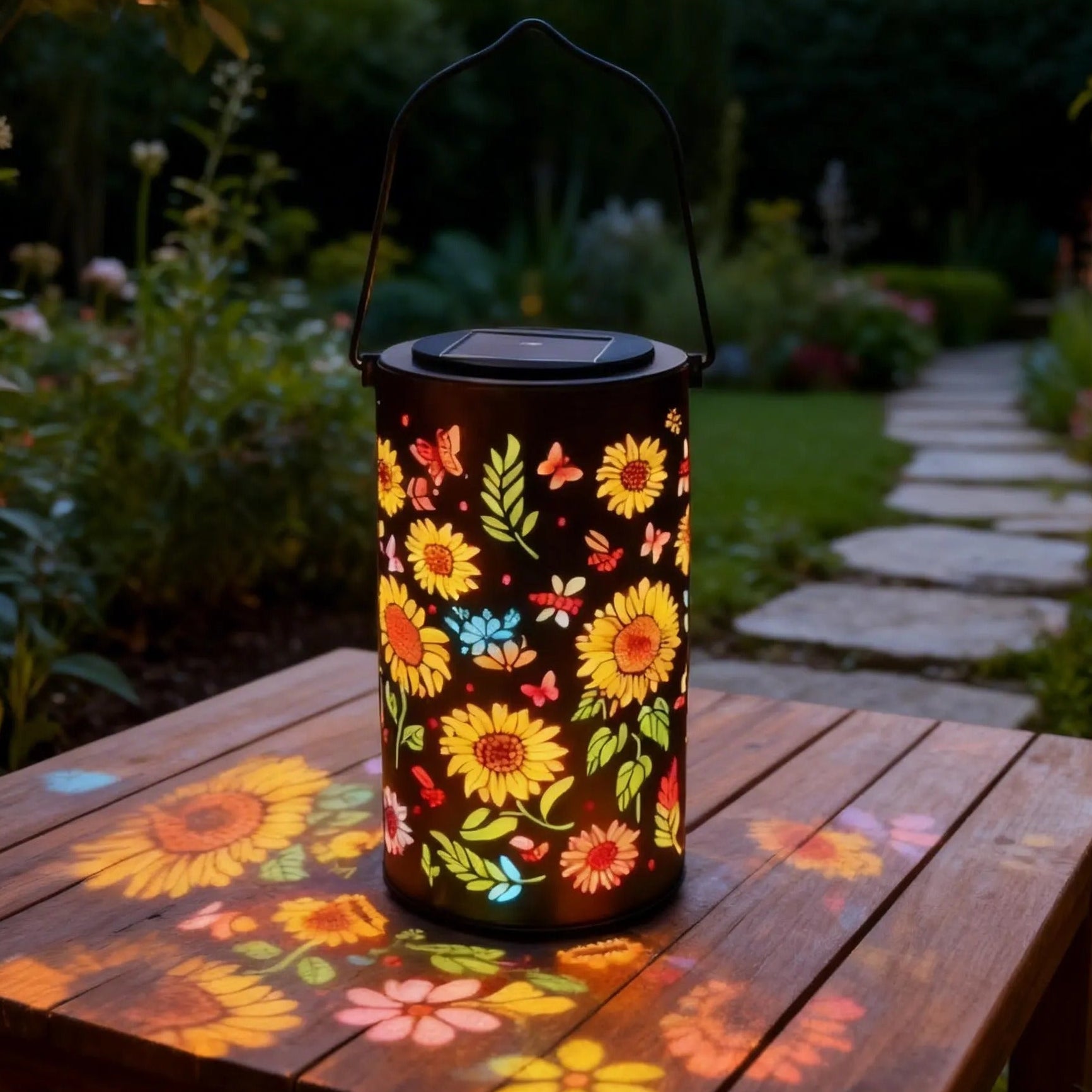 Floral-patterned lantern casting shadows on a wooden table in a garden setting